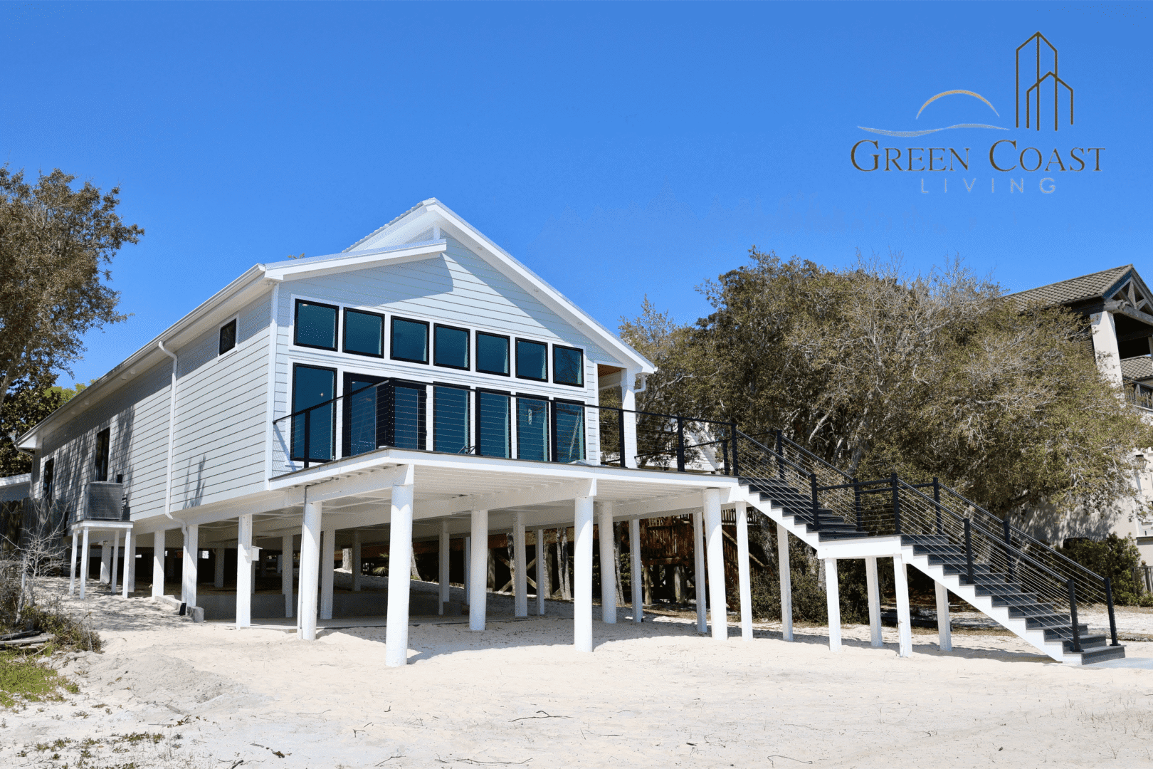 Elevated bayfront custom home with large windows and deck in Orange Beach, Alabama