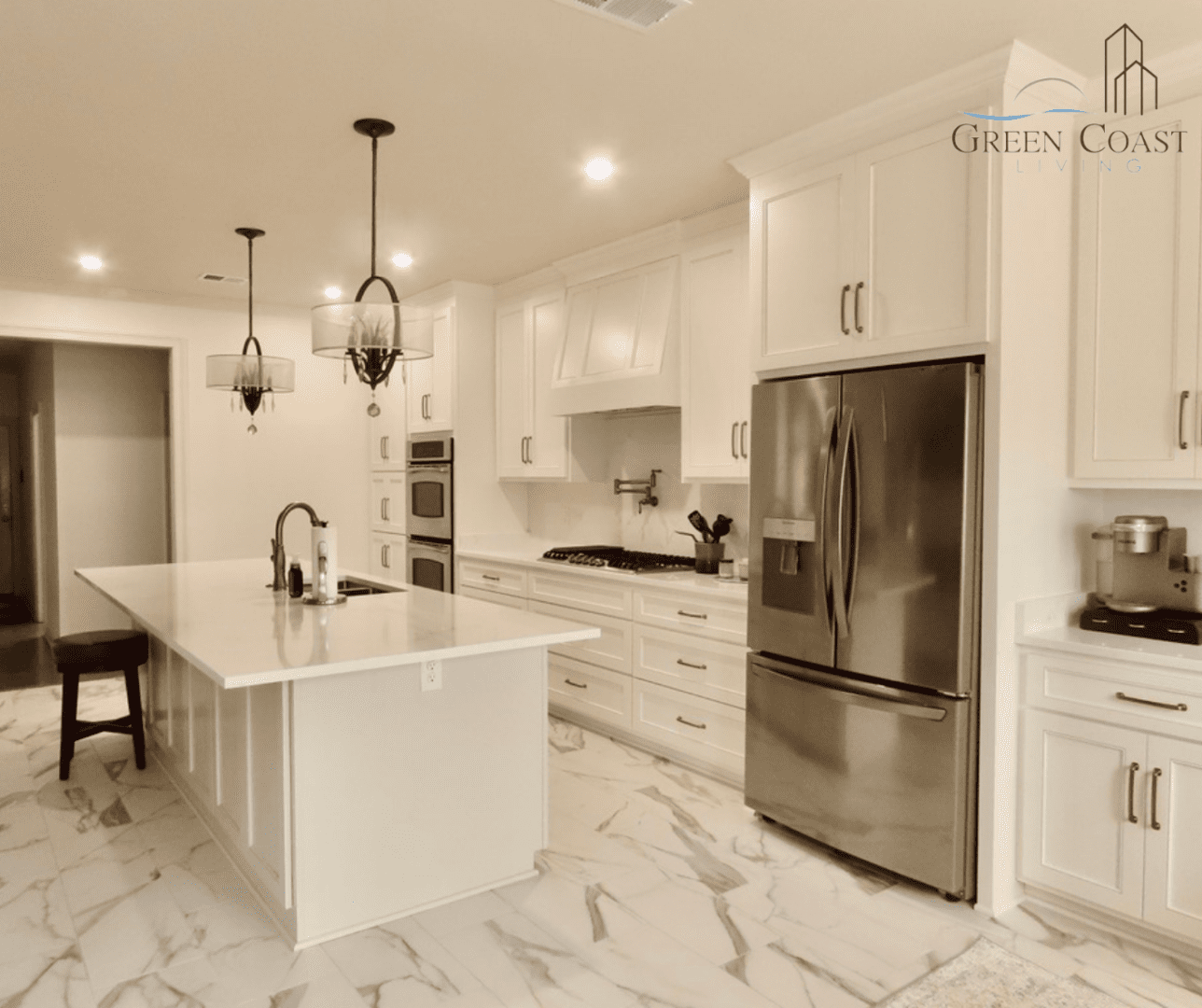 Modern white kitchen with island and refrigerator